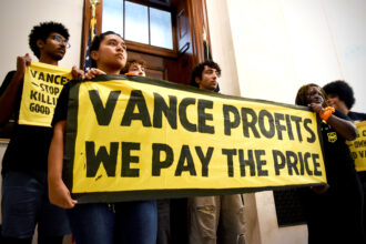 Sunrise Movement activists rally to protest J.D. Vance’s ties to Big Oil outside his office in Washington on Monday. Credit: Adah Crandall