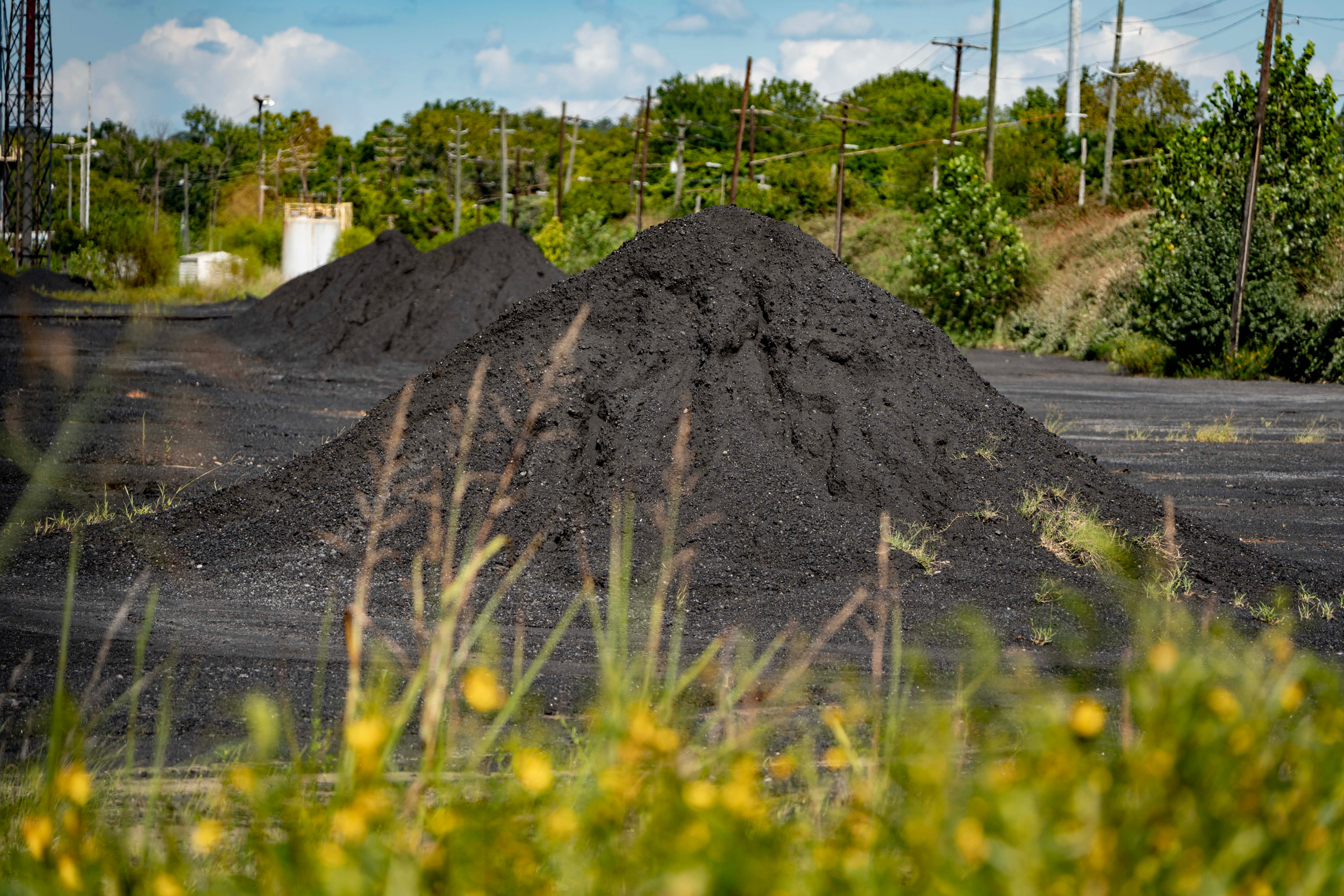 Piles of coal and coke waste remain on the ground at the Bluestone Coke in Birmingham, Ala. nearly three years after the plant closed. Credit: Lee Hedgepeth/Inside Climate News