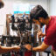 University of Maryland graduate research assistants work on an elastocaloric cooling system prototype at the the school’s Center for Environmental Energy Engineering. Credit: Courtesy of Beth Panitz