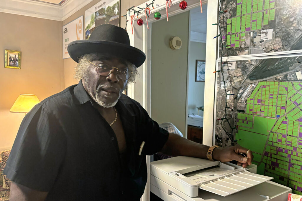 Charlie Powell points out properties he owns on a map of the EPA's 35th Avenue Superfund site in Birmingham, Ala. Credit: Dennis Pillion/Inside Climate News