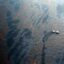 A boat works to collect oil that has leaked from the Deepwater Horizon wellhead in the Gulf of Mexico on April 28, 2010 near New Orleans, Louisiana. Credit: Chris Graythen/Getty Images