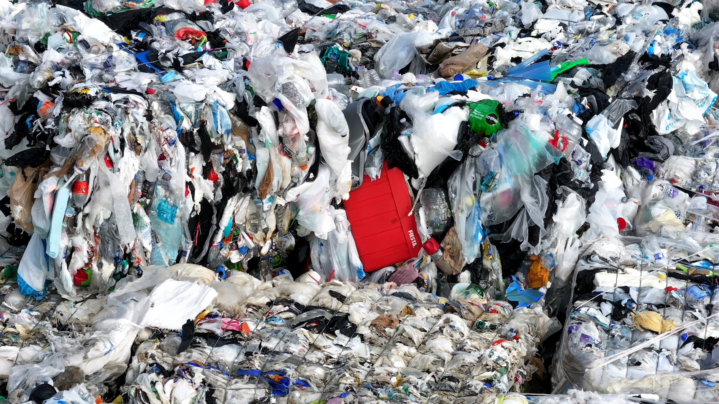 A pile of plastic waste are seen in May at Wright Waste Management in Houston. Credit: CBS News