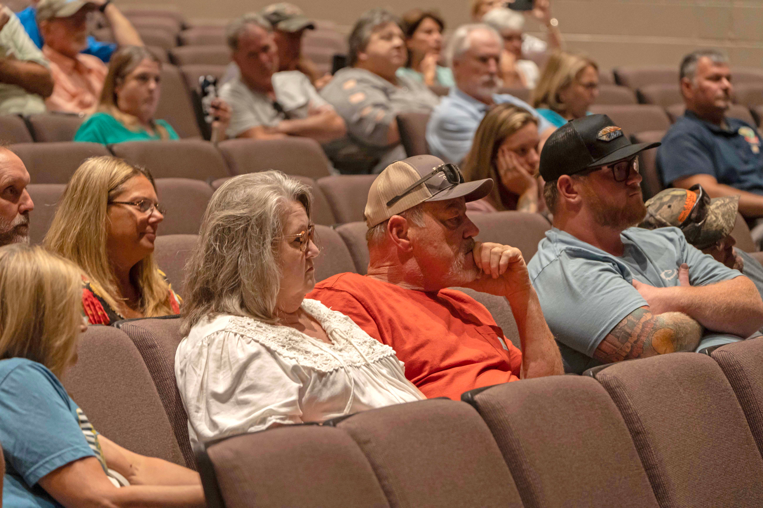 Dozens of residents watch as mining officials speak. Credit: Lee Hedgepeth/ Inside Climate News