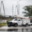 A Dominion Power utility truck drives down a road in Charleston, S.C. Credit: Sean Rayford/Getty Images