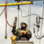 Linemen work on a rebuild of Northwestern Energy transmissions lines in Livingston, Montana. Credit: William Campbell/Getty Images