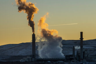 A view of the Naughton coal-fired power plant in Kemmerer, Wyo. The plant is scheduled to be decommissioned by 2025 and TerraPower plans to build a nuclear plant nearby. Credit: Natalie Behring/Getty Images