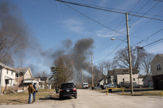 Smoke rises from the derailed cargo train in East Palestine, Ohio, on Feb. 4, 2023. Credit: Dustin Franz/AFP via Getty Images