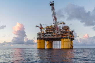 An offshore oil drilling rig is seen in the Gulf of Mexico. Credit: Ron Buskirk/UCG/Universal Images Group via Getty Images