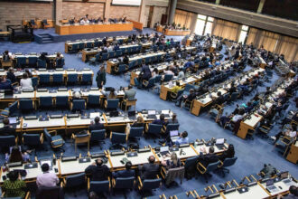 U.N. delegates follow the day's proceedings during the Intergovernmental Negotiating Committee's third meeting to formulate an international legally binding plastics treaty in Nairobi, Kenya on Nov. 14, 2023. Credit: James Wakibia/SOPA Images/LightRocket via Getty Images