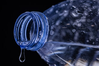 A liter of bottled water may contain nearly a quarter million pieces of the smallest particles of plastic. Credit: Joel Saget/AFP via Getty Images