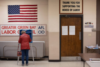 A Wisconsin resident casts their ballot in the state's primary election at a polling location on April 2 in Green Bay, Wisconsin. Credit: Scott Olson/Getty Images