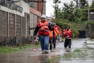 Members of the Kenya Red Cross asses an area affected by floods while looking for residents trapped in their homes following torrential rain in Kitengela on May 1. Credit: Luis Tato/AFP via Getty Images