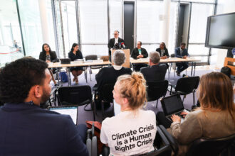 Payam Akhavan (center), lawyer and chairman of the Commission of Small Island States, speaks at a press conference on Tuesday in Hamburg, Germany after the International Tribunal for the Law of the Sea issued a legal opinion on measures to protect the oceans from climate change. Credit: Christian Charisius/Picture Alliance via Getty Images