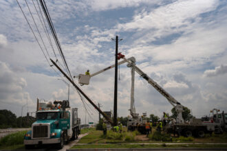 CenterPoint foreign assistance crews work to restore power lines on Thursday in Houston after Hurricane Beryl knocked out power for millions of people in the city. Credit: Danielle Villasana/Getty Images