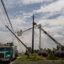 CenterPoint foreign assistance crews work to restore power lines on Thursday in Houston after Hurricane Beryl knocked out power for millions of people in the city. Credit: Danielle Villasana/Getty Images