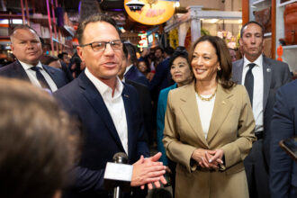 Pennsylvania Gov. Josh Shapiro (left) and Vice President Kamala Harris speak to the press at the Reading Terminal Market in Philadelphia on July 13. Credit: Ryan Collerd/AFP via Getty Images