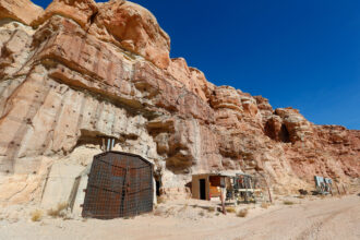 Entrances to a uranium mine are locked shut outside Ticaboo, Utah. Credit: Photo by George Frey/Getty Images