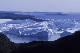 The Ilulissat Ice fjord in Greenland runs west 25 miles from the Greenland ice sheet to Disko Bay close to Ilulissat town. Credit: Veronique Durruty/Gamma-Rapho via Getty Images.