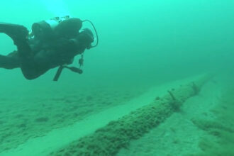 A National Wildlife Federation diver inspects Enbridge’s Line 5 pipeline at the bottom of the Straits of Mackinac. Credit: National Wildlife Federation video screenshot