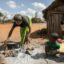 Helmine Monique Sija, about 50 years old, prepares raketa (cactus) to eat with her daughter Tolie, 10 years old, in the village of Atoby, commune of Behara, on Aug. 30, 2021. Research says climate change could make famines worse. Credit: Rijasolo/AFP via Getty Images