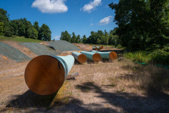 Steel pipe sections of the Mountain Valley Pipeline during construction in Bent Mountain, Virginia, in August 2022. The pipeline became operational on Friday. Credit: Robert Nickelsberg/Getty Images