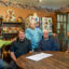 Clara Riley stands among her relatives and neighbors in her Oak Grove home. Credit: Lee Hedgepeth/Inside Climate News