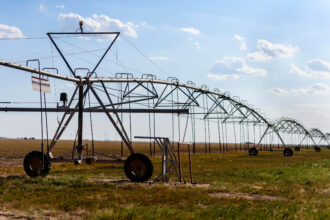 A farm irrigation system is seen near Ralls, Texas, about 30 miles east of Lubbock. Texas leads the nation in crop insurance payouts due to drought, and those costs are expected to increase because of climate change. Credit: Trace Thomas/The Texas Tribune