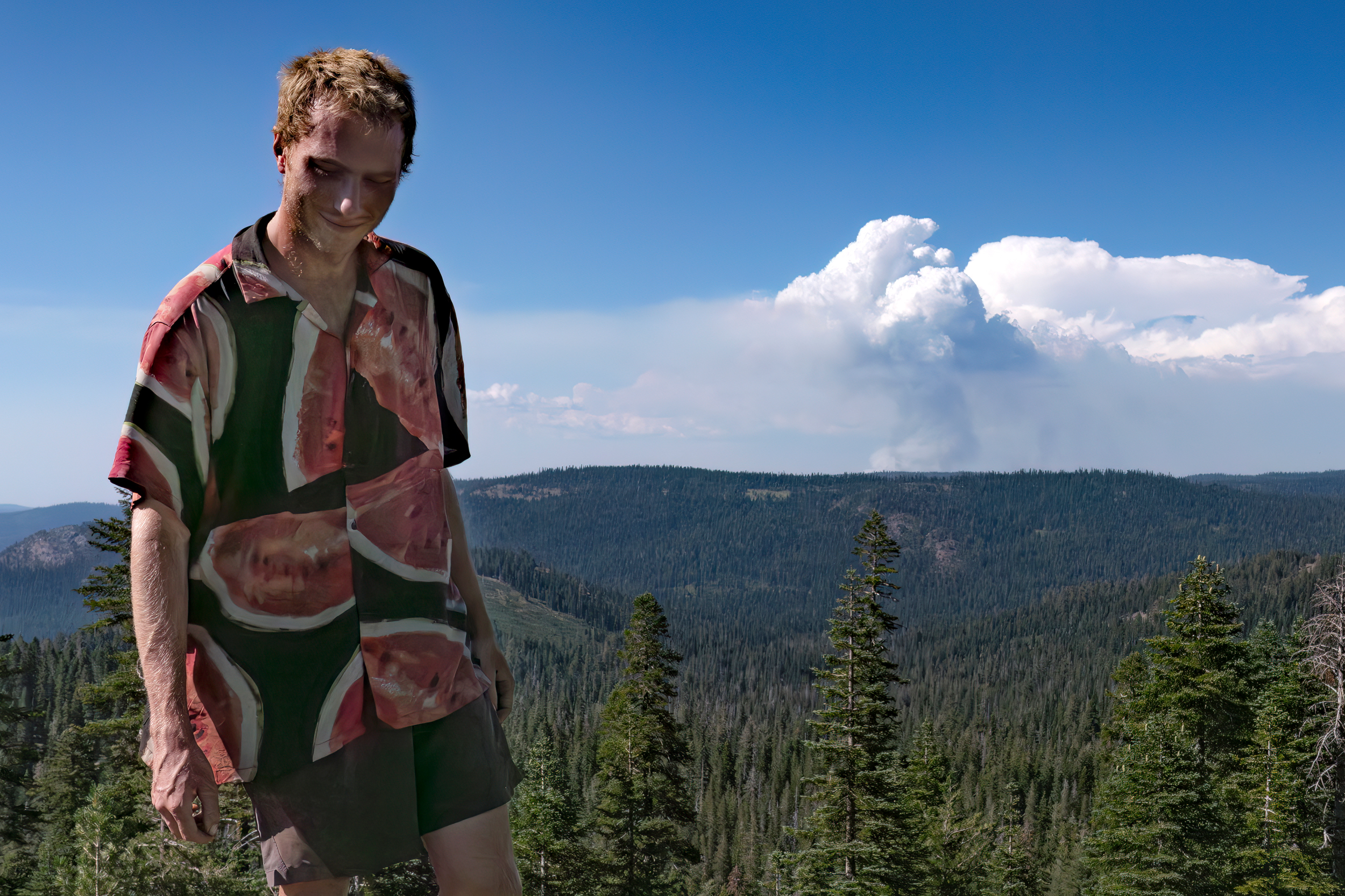 Can Do stands on a cliff after spotting wildfire smoke in the horizon and calling the Yuba River Ranger District. Credit: Bing Lin/Inside Climate News